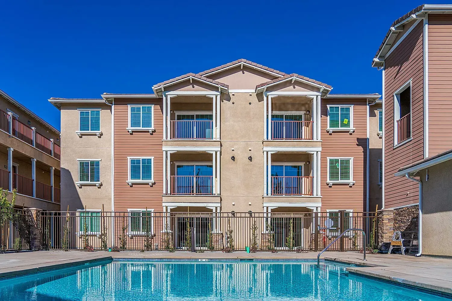 The swimming pool at Turtle Creek, with three-story apartment buildings behind it