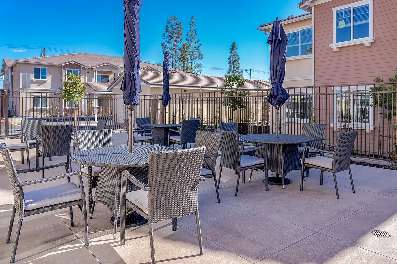 Tables, chairs and umbrellas on the patio at Turtle Creek